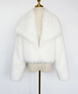 Close-up of fluffy white faux fur texture and wide lapel collar on cropped jacket