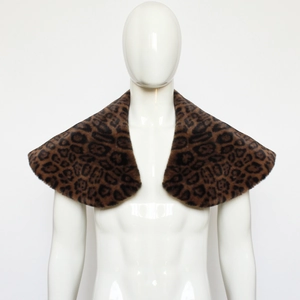 Close-up of medieval Viking warrior faux fur leopard print shawl on model shoulders