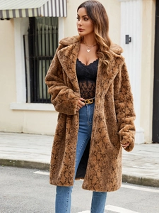 Chic women's faux fur coat with brown snakeskin print and thick plush texture for winter
