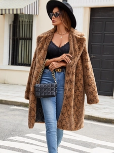 Women's faux fur coat with brown snakeskin pattern and vintage American aesthetic style