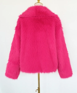 Rear view of pink faux fur short jacket showing soft texture and wide collar on a golden hanger