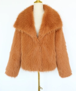 Detail of caramel faux fur texture and wide lapels on women's winter short jacket