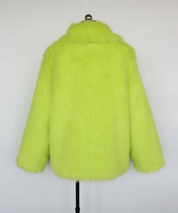 Detailed view of plush fluorescent green faux fur texture on a cropped men's jacket