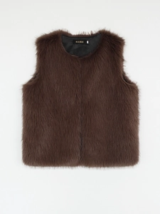 Macro shot of faux fur vest lining with AIXIRUI brand label and size M tag