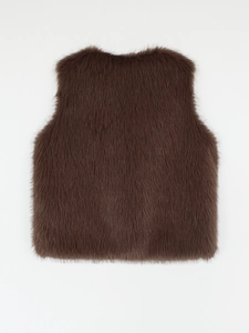 Detailed view of the dark brown faux fur texture and long fluffy fibers on the vest