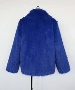 Rear view of vibrant blue faux fur jacket with fluffy long hair texture and stand collar