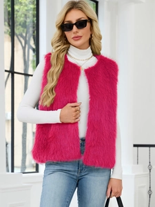 Detailed texture of rose red faux fur vest styled with white turtleneck sweater