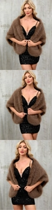 Detail view of brown faux fox fur shawl paired with a black sequin evening gown