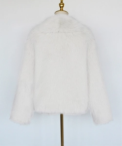 Detailed back view of a white faux fur jacket on a mannequin showing thick plush texture