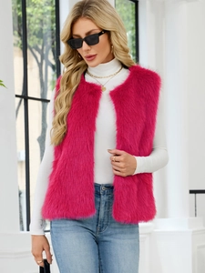 Detail of bright pink faux fur vest texture with sleeveless open front design