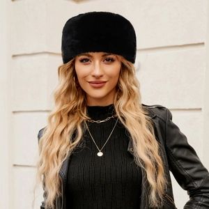 Close-up of the plush black faux fur texture and soft material on the winter headband