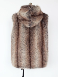 Detail of faux fox fur vest with a large hood in brown grey gradient stripes