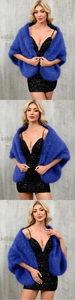 Detail of royal blue faux fox fur shawl with thick texture paired with evening dress