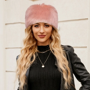 Close-up of pink faux fur hat showing fluffy long-pile texture and Russian style fit