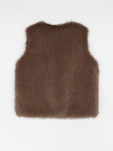 Detailed close-up of brown faux fur vest texture showing soft long hair and glossy fibers
