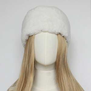 Detailed close-up of white faux fur winter hat texture on a model mannequin