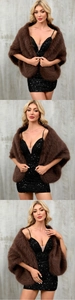 Detail of faux fox fur shawl in dark brown, elegant accessory for evening dresses