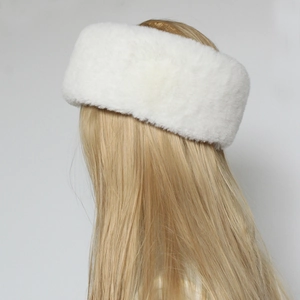 Detailed texture of white faux fur headband showing high-density soft plush material