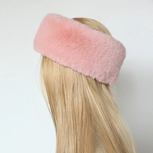 Detail of pink faux fur headband showing soft plush texture and warm ear warmer style