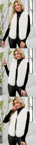 Détail macro du gilet long en fausse fourrure blanche et texture moelleuse sur un mannequin