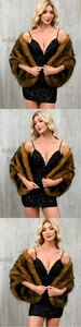 Detailed view of luxury faux fox fur shawl paired with a black sequin party dress