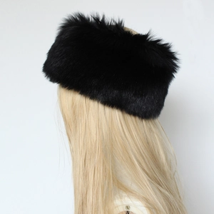 Detail view of premium black faux fur headband showing fluffy texture and warm winter material