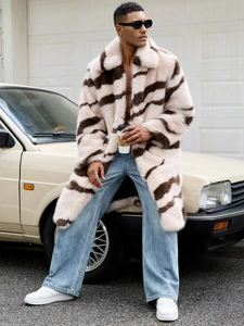 Detail of faux fox fur texture and zebra stripes on long winter coat for men