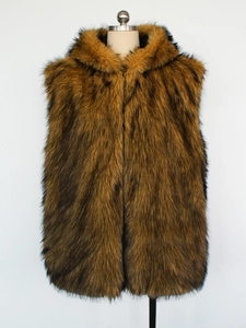 Detail view of plush brown faux fur texture and hood on longline vest for men