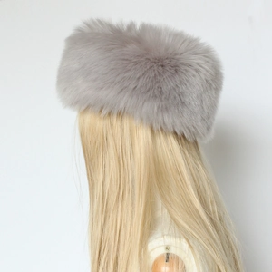 Close-up of grey faux fur headband on model showing soft fluffy winter accessory texture