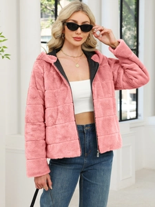 Stylish pink faux fur hooded jacket with zipper closure for women in urban winter fashion