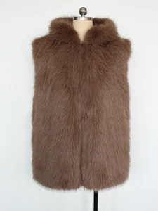 Detailed close-up of brown faux fur vest with hood showing high-quality fluffy texture