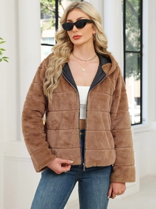 Detail of a brown faux rabbit fur hooded jacket with high-quality metal zipper and plush texture