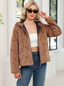 Close-up of brown faux fur hooded jacket featuring horizontal quilting and silver zipper detail