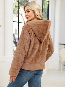 Detail view of brown faux fur hooded jacket with horizontal quilted plush texture