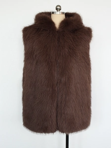Detail shot of plush dark brown faux fur vest with soft texture and hood on a mannequin