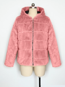 Detailed texture of pink faux rabbit fur jacket with horizontal stripes and metal zipper