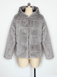 Detail of grey faux rabbit fur jacket featuring horizontal quilting and a metal zipper