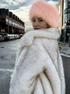 Chic pink faux fur headband hat and white long coat for winter fashion outdoor warmth