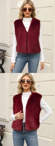 Detail of burgundy faux fur vest paired with a white turtleneck for autumn style