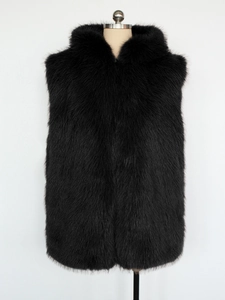 Detailed close-up of fluffy black faux fur vest with hood showing high-quality texture