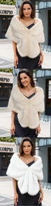 Close-up of fluffy faux fur shawl in beige and white for elegant bridal wedding dresses