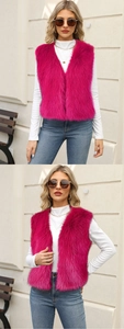 Outdoor street view of a plush rose red faux fur vest with deep V-neck and sleeveless cut