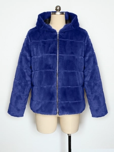 Detail of navy blue faux rabbit fur jacket featuring horizontal quilted texture and zipper