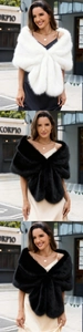 Detail of soft faux fox fur shawl in white and black for elegant wedding bridal wear