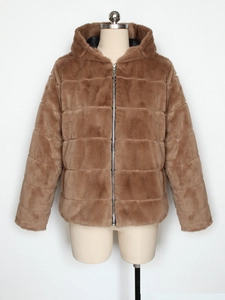Detail of brown faux fur jacket showing horizontal quilting texture and metal zipper