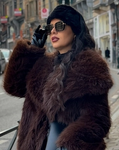 Detail of premium faux fur headband in dark brown with thick plush winter texture
