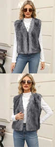 Detail view of plush dark gray faux fur vest showing texture and premium lining quality