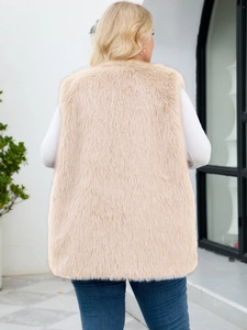 Back view of apricot faux fur vest with soft long plush texture for autumn layering