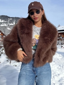 Deep brown faux fur coat with oversized lapel and thick plush texture for winter