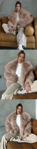 Detail of pink faux fur coat showing fluffy texture, large collar, and elasticated cuffs